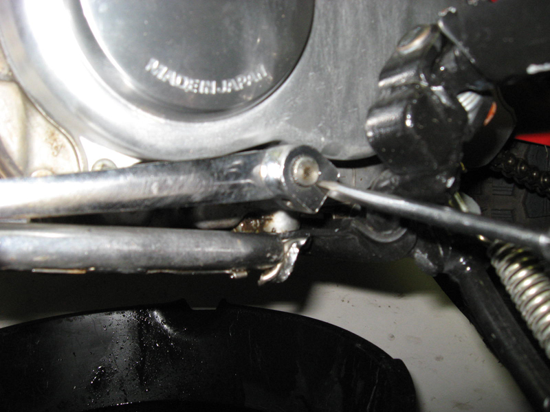 AG wedge flat blade screwdrver into shifter DO NOT PRY